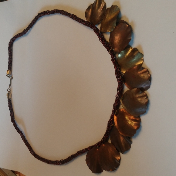 Sculpted metal petals on braided maroon cord necklace - Picture 1 of 3